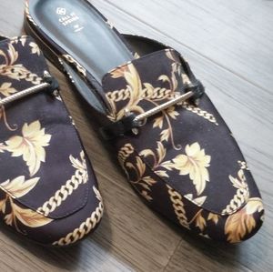 Call it Spring black and gold flats